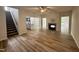 Bright living room featuring a fireplace, open floor plan, and hardwood floors at 427 Earnest Way # L24, Kenly, NC 27542