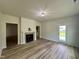Inviting living room featuring a fireplace and a view into the kitchen at 427 Earnest Way # L24, Kenly, NC 27542