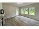 Cozy living room with hardwood floors, fireplace and large bright windows at 427 Earnest Way # L24, Kenly, NC 27542