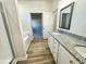 Primary bathroom with granite countertop vanity, soaking tub, and a walk-in shower at 427 Earnest Way # L24, Kenly, NC 27542