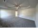 Spacious main bedroom with tray ceiling, ceiling fan, carpeted floor and natural light at 427 Earnest Way # L24, Kenly, NC 27542