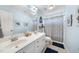 Light and airy bathroom featuring double vanity, decorative accents, and whale themed shower curtain at 429 Gambit Cir, Wake Forest, NC 27587