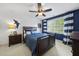 Cozy bedroom features a dark wood bed frame and nautical themed decor at 429 Gambit Cir, Wake Forest, NC 27587