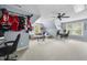 Spacious bonus room with light-blue walls, ceiling fan, and comfortable seating area at 429 Gambit Cir, Wake Forest, NC 27587