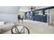 Multi-use bonus room featuring a large TV, built-in shelving, and comfortable seating area at 429 Gambit Cir, Wake Forest, NC 27587