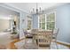 Bright breakfast nook offering ample sunlight, a round table with seating, and a seamless transition to the living area at 429 Gambit Cir, Wake Forest, NC 27587