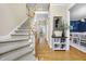 Bright foyer with staircase, hardwood floors, and decor leading to other rooms at 429 Gambit Cir, Wake Forest, NC 27587