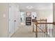 Second floor hallway with access to bedrooms; view of a display bookshelf at 429 Gambit Cir, Wake Forest, NC 27587