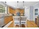 Bright kitchen featuring a center island with bar stools and ample counter space at 429 Gambit Cir, Wake Forest, NC 27587