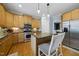 Kitchen with wood cabinets, granite countertops and stainless steel appliances at 429 Gambit Cir, Wake Forest, NC 27587