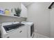 Functional laundry room with modern appliances, ample counter space, and built-in storage at 429 Gambit Cir, Wake Forest, NC 27587