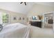 Light-filled main bedroom features vaulted ceiling and ensuite bathroom at 429 Gambit Cir, Wake Forest, NC 27587