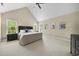 Bright main bedroom featuring vaulted ceiling, ensuite, with natural light from large windows at 429 Gambit Cir, Wake Forest, NC 27587