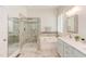 Bathroom featuring double sinks, soaking tub, stand alone shower, tile surround and mosaic accents at 43 Turtle Point Bnd, Chapel Hill, NC 27516