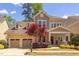 Charming two-story home with a well-manicured lawn, two-car garage, and inviting front porch at 43 Turtle Point Bnd, Chapel Hill, NC 27516
