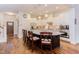Spacious kitchen with hardwood floors, marble countertops, modern appliances, and breakfast bar with chairs at 43 Turtle Point Bnd, Chapel Hill, NC 27516