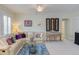 Living room with plush sofa, decorative pillows, stylish rug, ceiling fan, and music setup at 43 Turtle Point Bnd, Chapel Hill, NC 27516