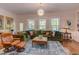 Cozy living room showcasing hardwood floors, a large sectional sofa, an area rug, and natural light at 43 Turtle Point Bnd, Chapel Hill, NC 27516