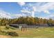 Overhead shot of community tennis courts surrounded by mature trees under a partly cloudy sky at 43 Turtle Point Bnd, Chapel Hill, NC 27516