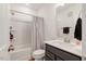 Well-lit bathroom with a shower and tub combo, and a vanity at 433 Wait Ave # 100, Wake Forest, NC 27587