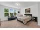 Inviting bedroom with neutral tones, garden view, and comfortable furnishings at 433 Wait Ave # 100, Wake Forest, NC 27587