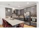 Stylish kitchen featuring gray cabinets, quartz countertops, and stainless steel appliances at 433 Wait Ave # 100, Wake Forest, NC 27587
