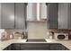 Close-up of the sleek kitchen area featuring an electric cooktop and modern cabinets at 433 Wait Ave # 100, Wake Forest, NC 27587