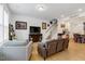 Inviting living room with neutral tones, hardwood floors, and staircase at 433 Wait Ave # 100, Wake Forest, NC 27587