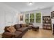Cozy living area filled with natural light, featuring a comfortable sofa at 433 Wait Ave # 100, Wake Forest, NC 27587