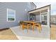 Outdoor patio featuring a dining set and screened-in porch, perfect for outdoor entertainment and relaxation at 437 Providence Springs Ln, Fuquay Varina, NC 27526