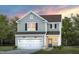 Charming two-story home with gray siding, a two-car garage, and manicured landscaping at 437 Providence Springs Ln, Fuquay Varina, NC 27526