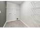 An empty laundry room featuring hard surface flooring and white wire shelving ready for customizable storage at 437 Providence Springs Ln, Fuquay Varina, NC 27526