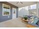 Cozy screened-in patio with comfortable seating, perfect for outdoor relaxation and enjoying the weather at 437 Providence Springs Ln, Fuquay Varina, NC 27526