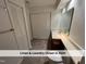 Bathroom has a linen closet and laundry closet at 4420 Beechnut Ln, Durham, NC 27707