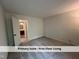Spacious carpeted bedroom with an open door leading to the bathroom at 4420 Beechnut Ln, Durham, NC 27707