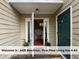 Inviting home entrance, featuring bright sidelights, and a view of the beautiful interior at 4420 Beechnut Ln, Durham, NC 27707