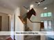 Bright foyer features staircase with a modern ceiling fan at 4420 Beechnut Ln, Durham, NC 27707