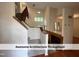 Beautiful staircase with carpeted steps and a wooden banister, leading to the upper level of the home at 4420 Beechnut Ln, Durham, NC 27707