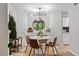 Modern dining area featuring a round table, stylish chairs, contemporary lighting, and built-in cabinets at 4507 Edwards Mill Rd # F, Raleigh, NC 27612