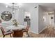 Contemporary dining area features modern lighting and an adjacent kitchen at 4507 Edwards Mill Rd # F, Raleigh, NC 27612