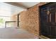 Entrance F features a black door and a side view of the balcony at 4507 Edwards Mill Rd # F, Raleigh, NC 27612