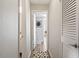 Hallway with light wood floors and a decorative rug at 4507 Edwards Mill Rd # F, Raleigh, NC 27612