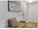 Hallway featuring artwork, seating, and storage at 4507 Edwards Mill Rd # F, Raleigh, NC 27612