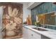 Kitchen with a flower mural on the wall, marble countertops, and modern stainless steel appliances at 4507 Edwards Mill Rd # F, Raleigh, NC 27612