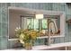 Bright and airy kitchen pass-through offering a view of the dining area at 4507 Edwards Mill Rd # F, Raleigh, NC 27612