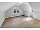 Finished attic space with hardwood floors, natural light, and dormer windows at 510 Guy Walker Way, Durham, NC 27703