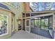 Open-air back deck featuring access to a screened porch, with a brick chimney at 510 Guy Walker Way, Durham, NC 27703