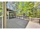 Expansive back deck perfect for outdoor gatherings with views of the surrounding trees at 510 Guy Walker Way, Durham, NC 27703