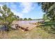 Lakefront home featuring a wooden dock with benches, offering stunning views and easy access to the water at 510 Guy Walker Way, Durham, NC 27703