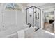 Luxurious bathroom features a soaking tub, separate glass shower, and marble accents at 510 Guy Walker Way, Durham, NC 27703